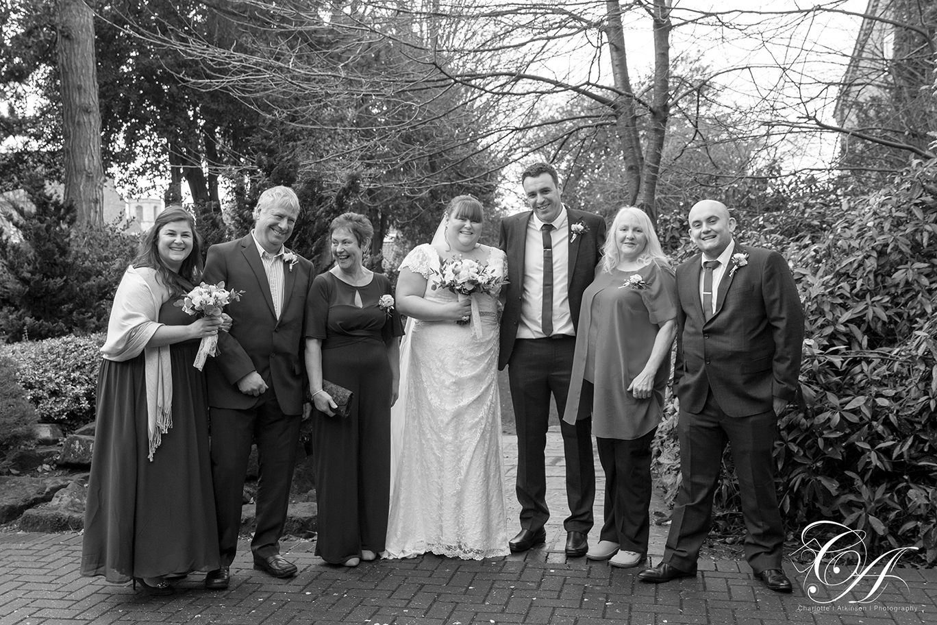Bridal party group wedding photo in the gardens at the York registry office