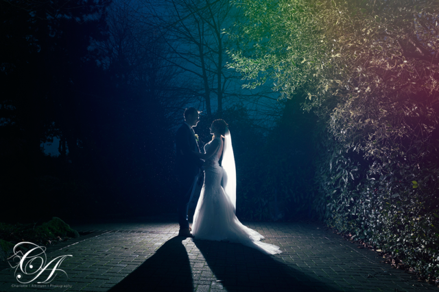 Bride and Groom facing each other in the rain at the York registry office