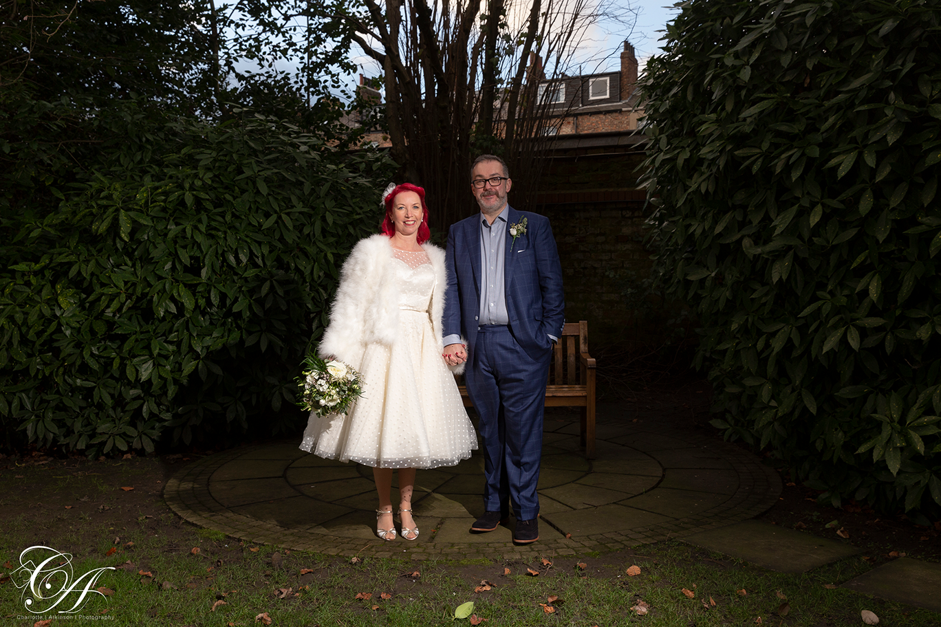 Bride and groom stood side by side in the York Registry Office gardens, york wedding photography