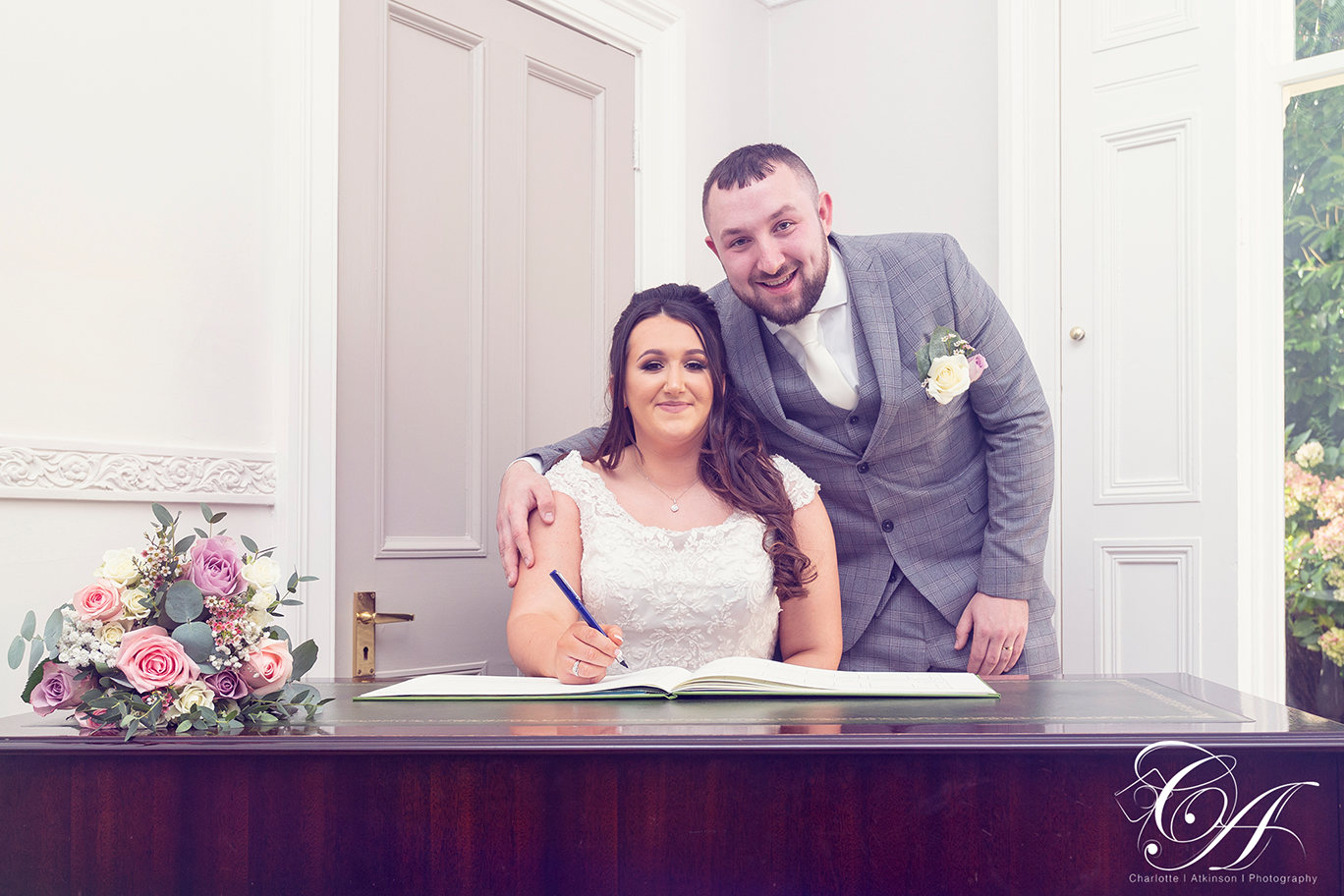 Bride and Groom signing the register, at York Registry Office