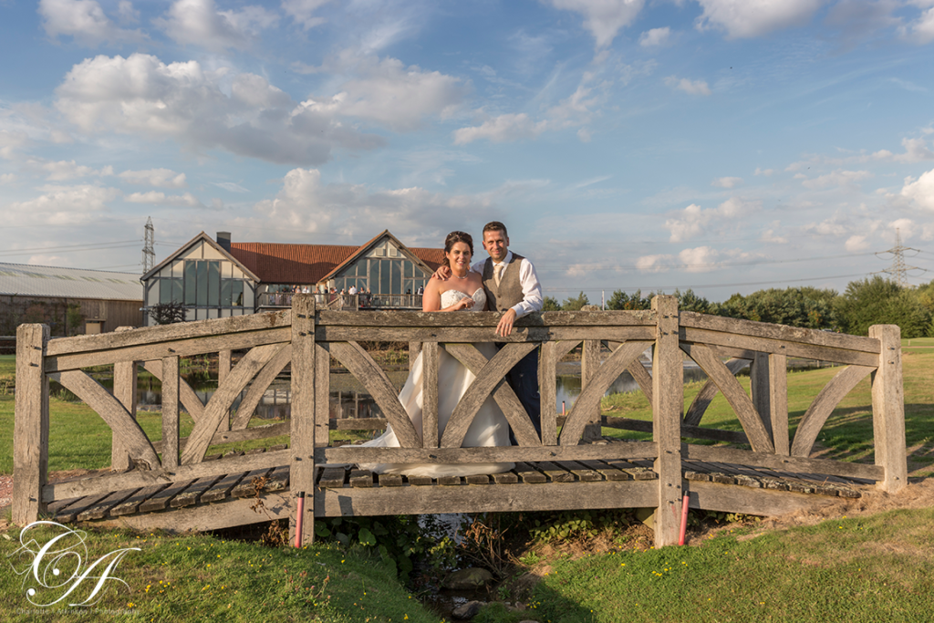 Wedding Photography from Sandburn Hall, with the bride and groom stood on the bride with the York Wedding Venue in the background