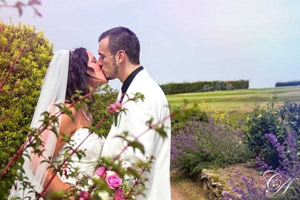 Couple kissing in the garden at Raven Hall Hotel. Ravenscar Wedding Photography